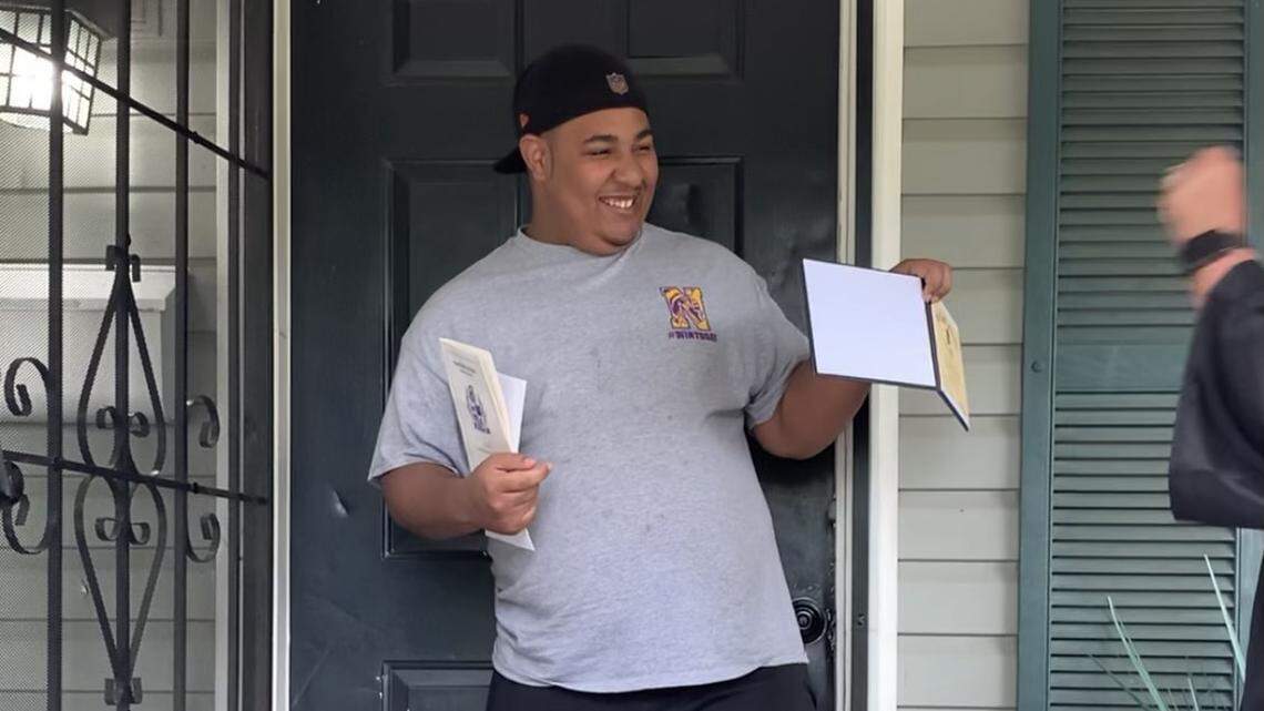 The front porch was the stage for this Northwestern High School student’s graduation