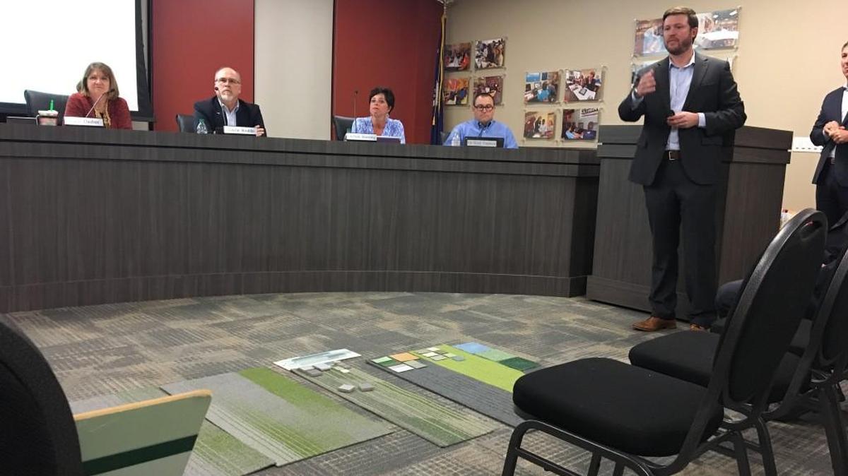 Todd Sease with Jumper Carter Sease Architects talks with the Fort Mill school board about color options for the new high school.