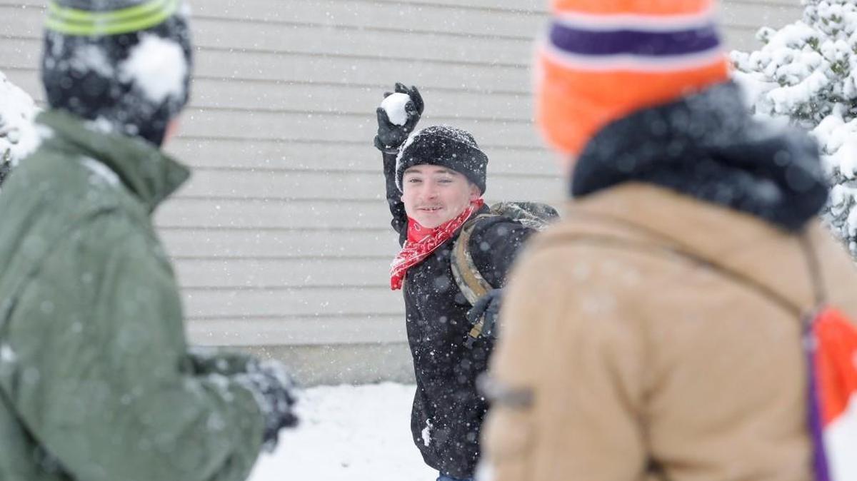 In this file photo, Dylan Ragz throws a snowball at his friends Luke Henley and Zachary Witham as Tega Cay receives a blanket of snow on Jan. 16. York, Chester and Lancaster schools have announced when students will make up the recent snow days.