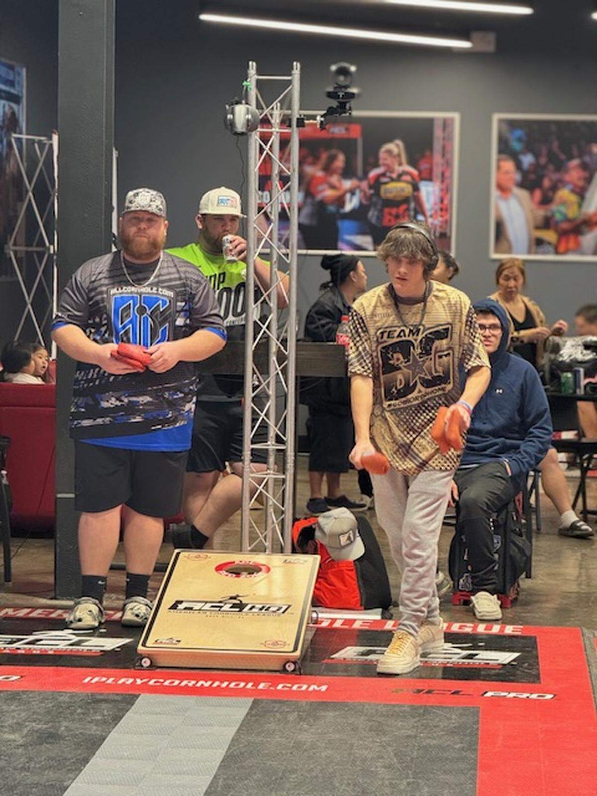 Jaxson Remmick throws beside top ranked pro Jamie Graham. Remmick and high school teammate Gavin Hamann are the first two players signed on to play cornhole at Winthrop.