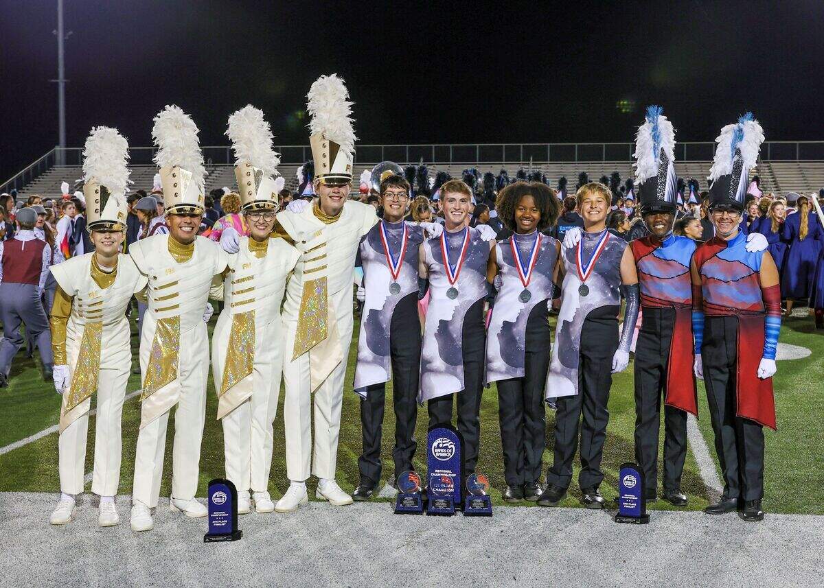 Drum majors from Fort Mill, Catawba Ridge and Nation Ford high schools celebrate all three bands taking top four spots at the Bands of America Southeastern Regional competition this fall near Atlanta. New enrollment figures could determine which bands compete against one another in state events starting next fall.