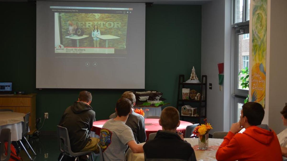 Students in the computer integrated manufacturing curriculum at the Floyd D. Johnson Technology Center, watch senior Micah Hancock conduct the virtual tour of the Meritor plant in York.