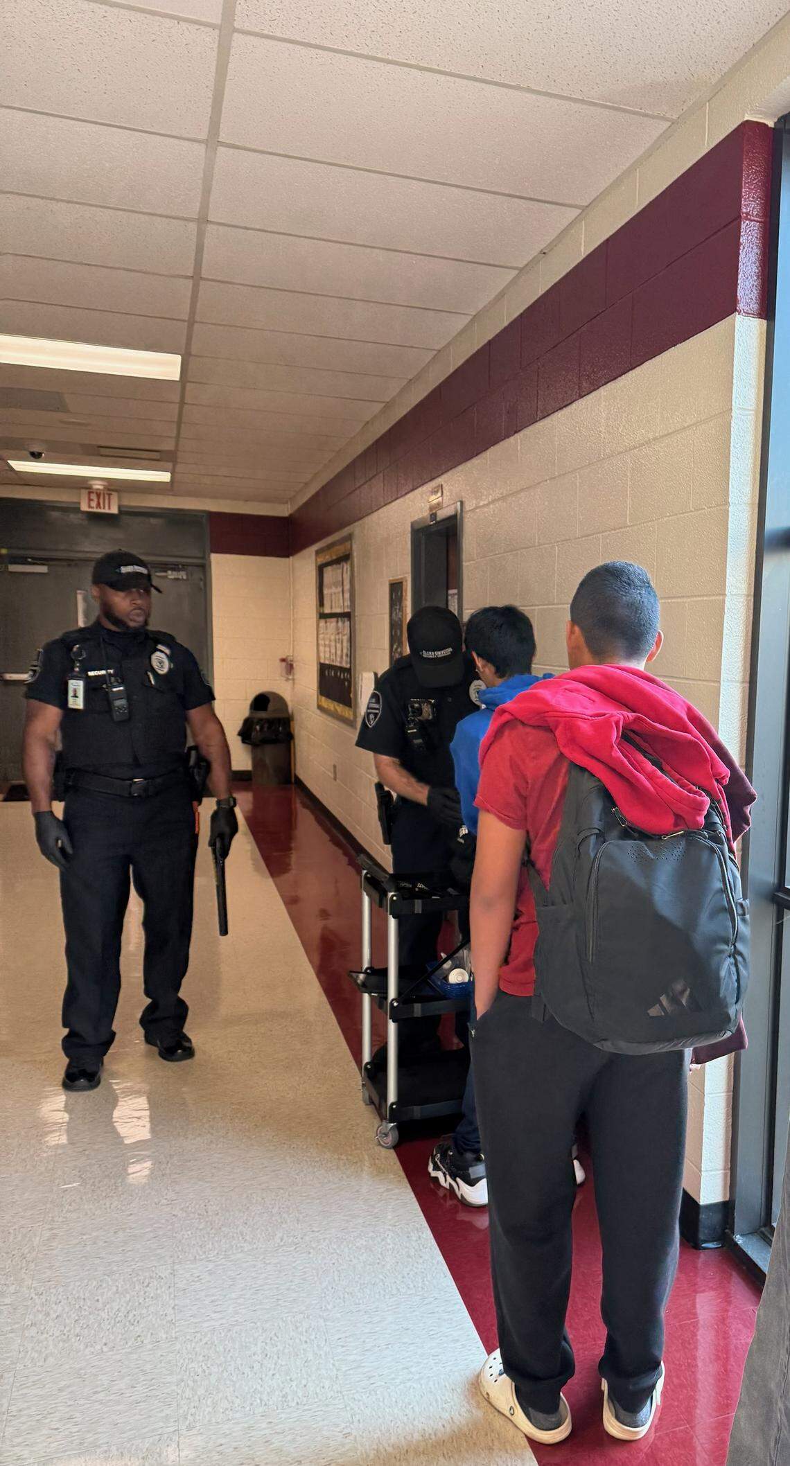 Students wait for a routine safety screening at a Rock Hill School District facility. The district uses weapons detection systemts and K-9 units as safety measures.