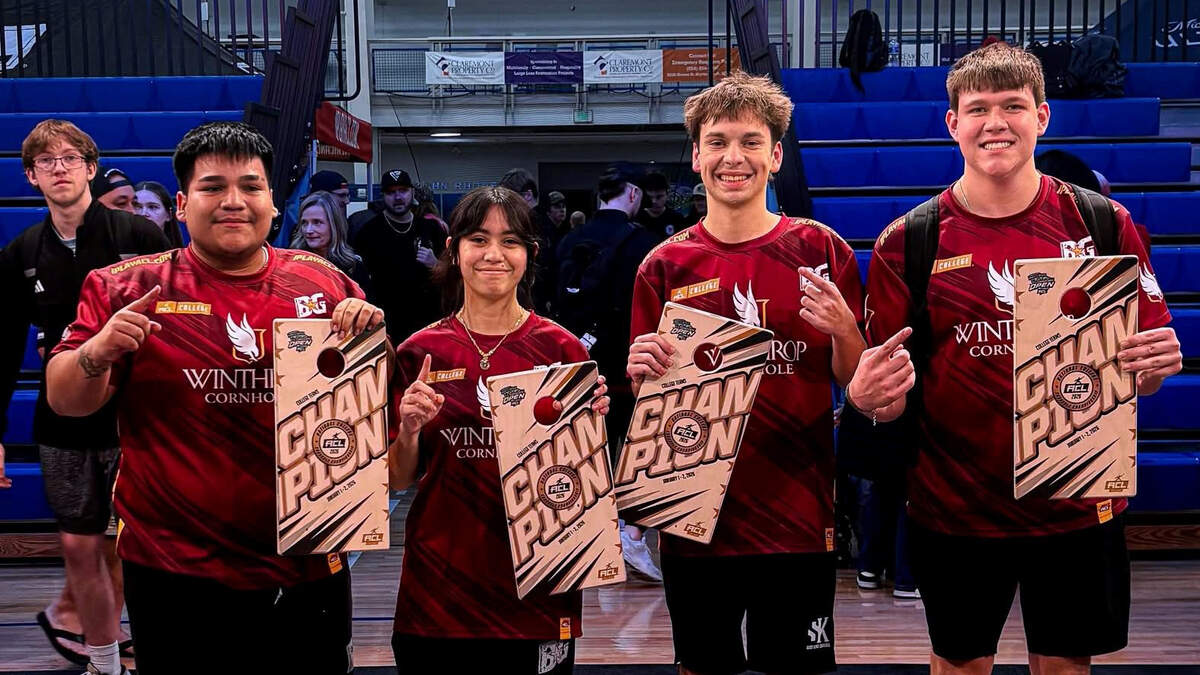 Winthrop Eagles Sal Sandoval, Mikayla Calvey, Hayden Gonzales and Dylan Graham celebrate after winning the team national championship for college cornhole.