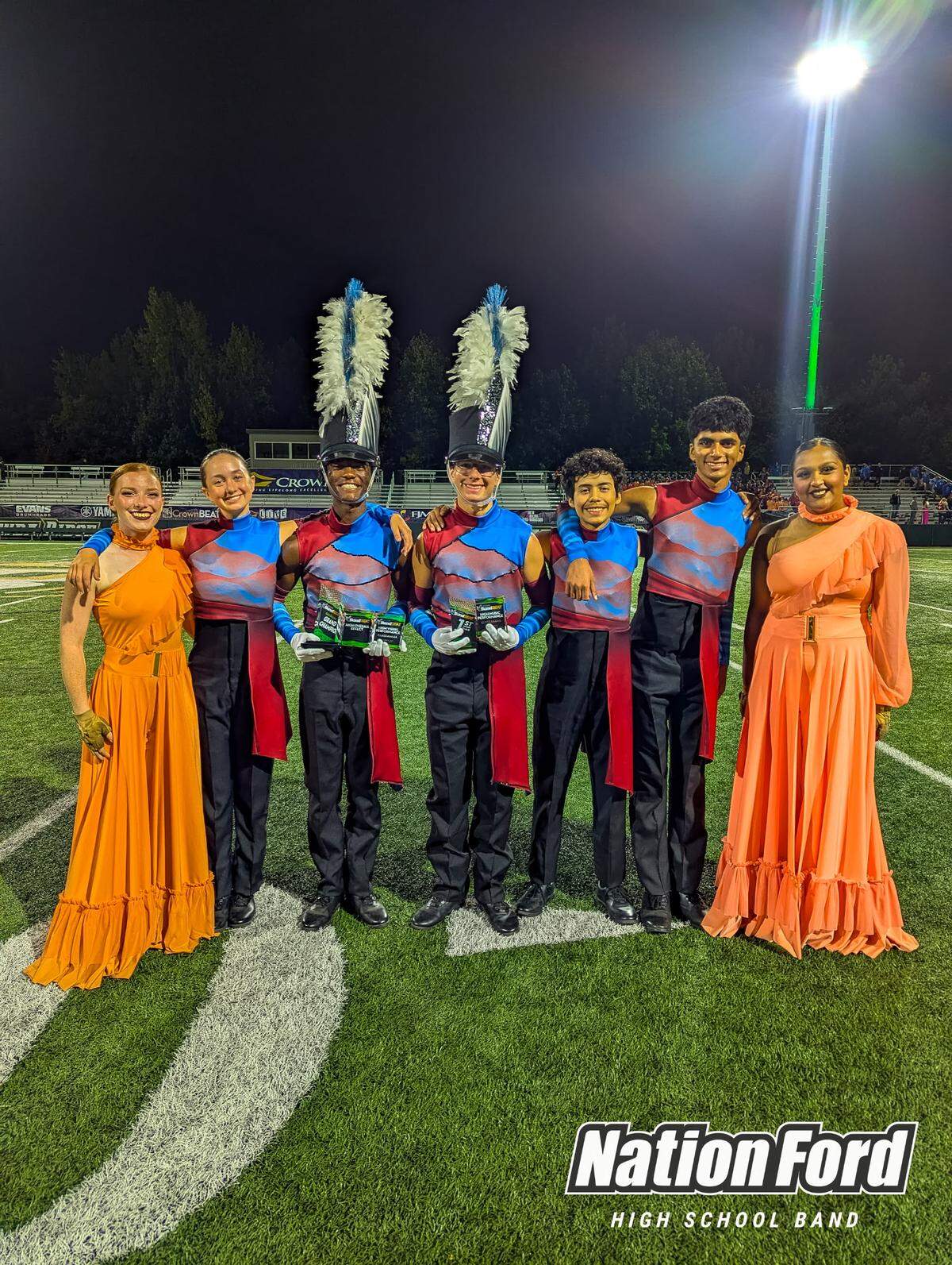 The Nation Ford High School marching band holds their awards earlier this month from the BandBEAT competition held at Catawba Ridge High School. Nation Ford just won its 11th state title.