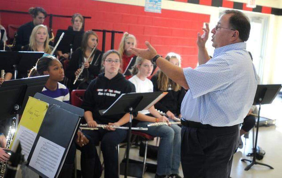 In this file photo. then-Nation Ford High Band Director Martin Dickey rehearses with woodwinds at the school. Dickey won state marching band titles at Fort Mill and Nation Ford high schools before starting the band program at Catawba Ridge, which has since won three titles.