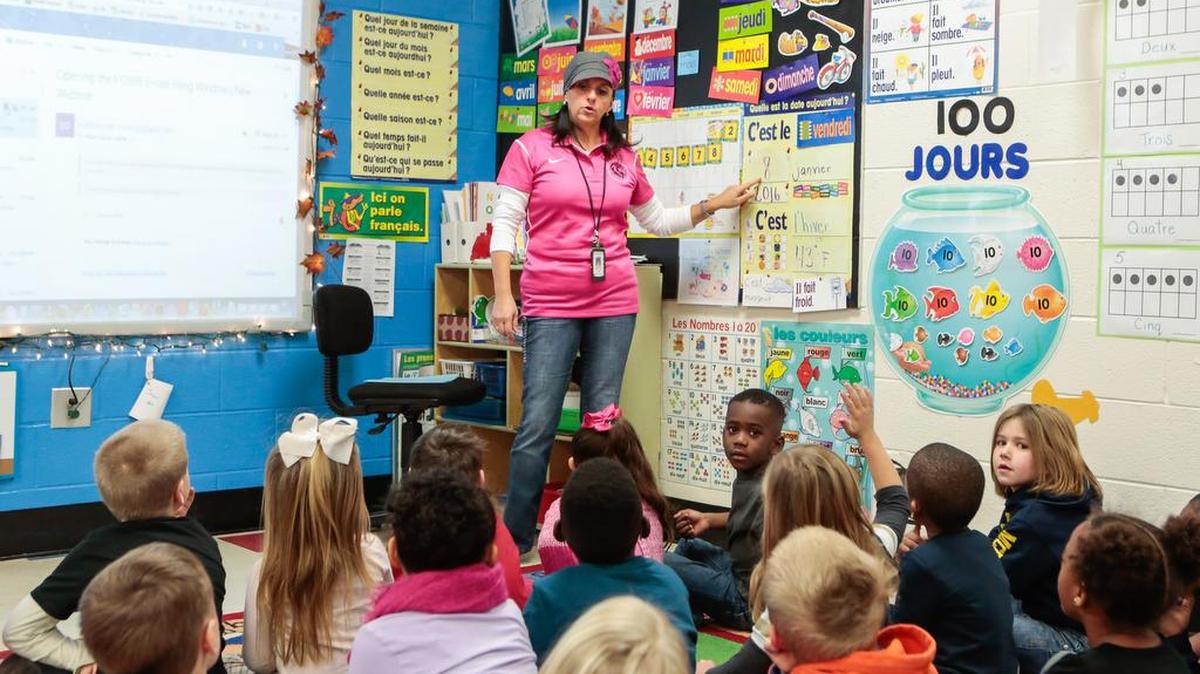 Kindergarten teacher Marie-Claude Ouellet stands before her French language immersion class at Rosewood Elementary School in Rock Hill.