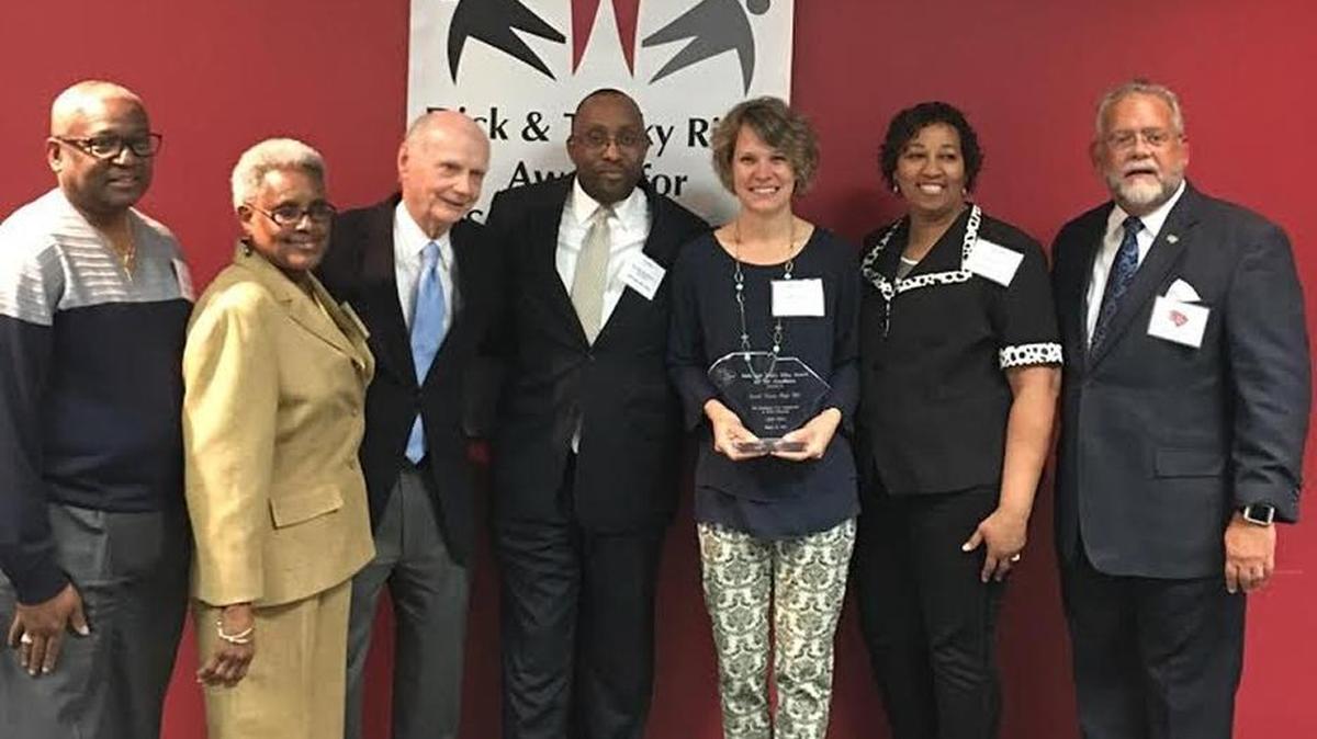 Rock Hill school district officials celebrate South Pointe High School’s SIC award win. From left: Tyrone Hart (former SPHS SIC chairperson and current SIC member), Mildred Douglass (school board member), Dick Riley (former SC governor and former US secretary of education), Dr. Al Leonard (principal SPHS), Rebecca Gilleland (SPHS SIC chairperson), Linda Gilmore (parent) and Tom Hudson (executive director, SC SIC)