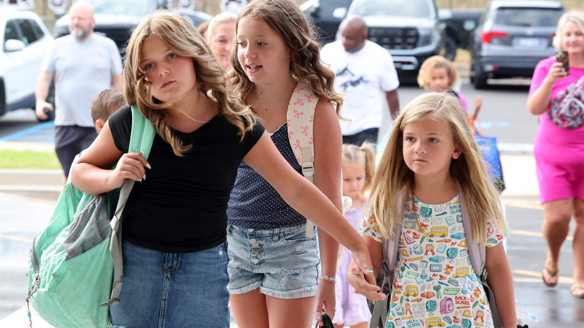 The South Carolina Department of Education released scores from its SC READY testing this spring. The Fort Mill,  Clover and Lancaster school districts took home top scores.. Seen here are Flint Hill Elementary School students walking to school on the first day on Aug. 4.