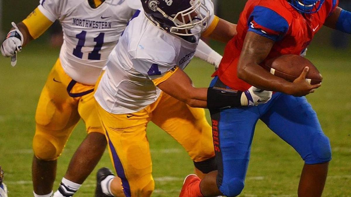 Northwestern football players in a 2015 game. Rock Hill schools recently adopted an online platform for student-athlete physicals.
