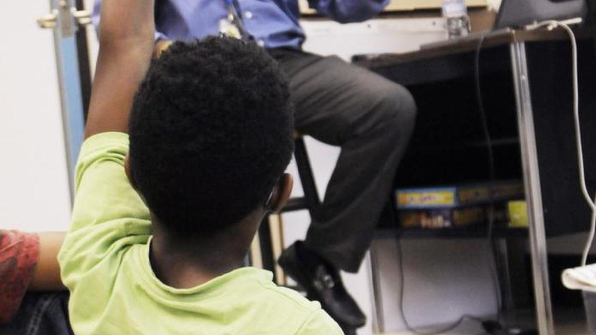 In this file photo, a child raises his land during a lesson given by Welvin Simpkins, a T3 school counselor. Multiple programs will join the T3 program in 2018 at the Sylvia Cirlcle campus. A naming committee has chosen a new name for the campus.