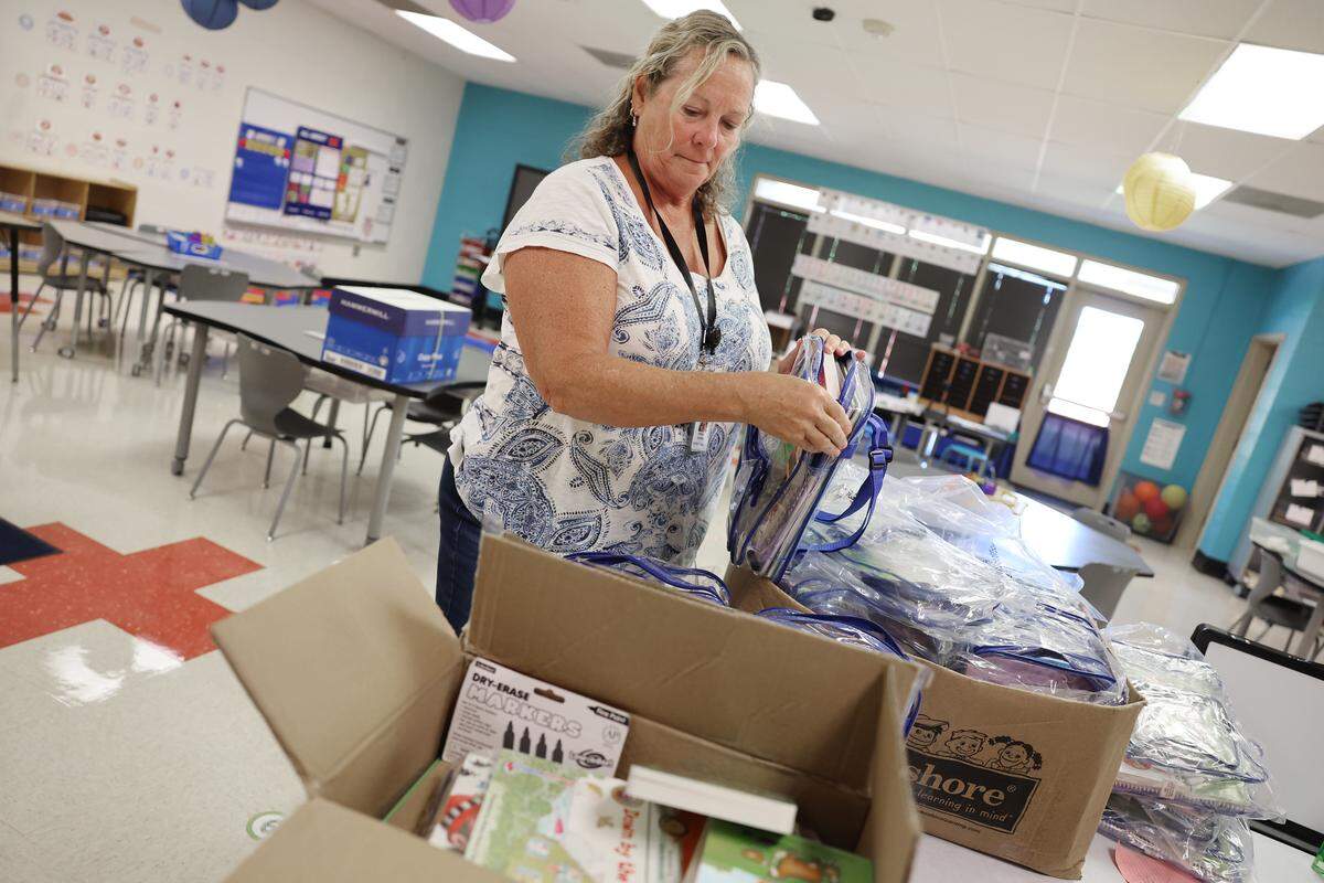 Elizabeth Anderson, kidergarten assistant at Richmond Drive Elementary School unpacks books Tuesday, July 29, 2025 at the Rock Hill, S.C. school.