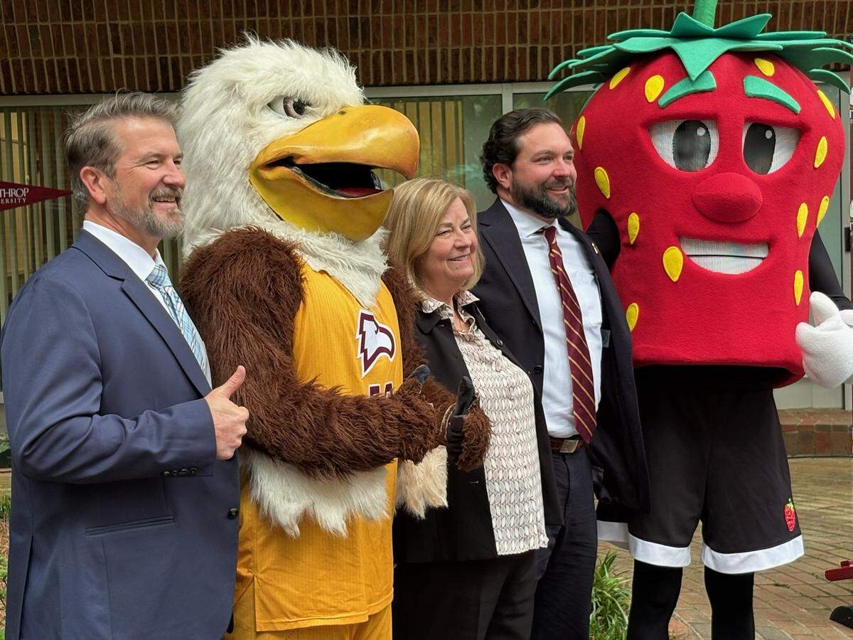 Winthrop University Provost and Vice President for Academic Affairs Sebastian van Delden, Fort Mill Mayor Guynn Savage and Winthrop Board of Trustees Chairman Joel Hamilton celebrate an agreement to bring a school campus to Fort Mill.
