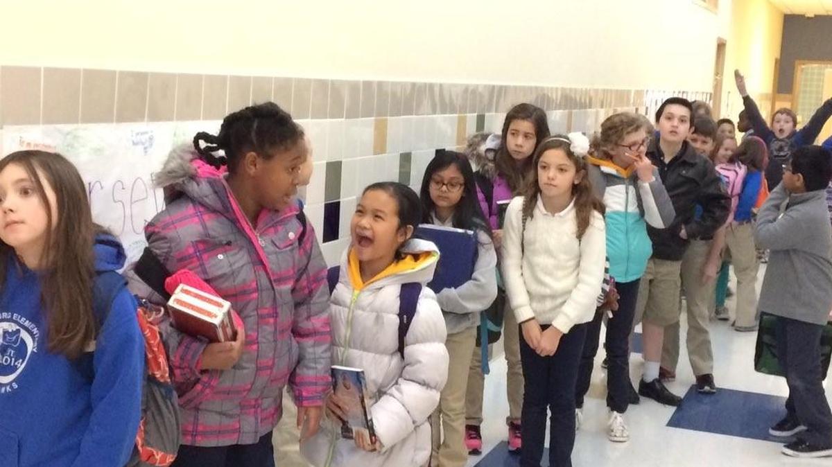 Students at Harrisburg Elementary line up to be sent home early because the school has no heat.