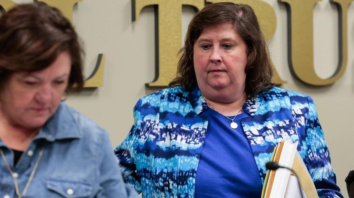 
Former Chester Superintendent Agnes Slayman leaves with the Chester County school board to enter executive session Thursday night. She later resigned.

