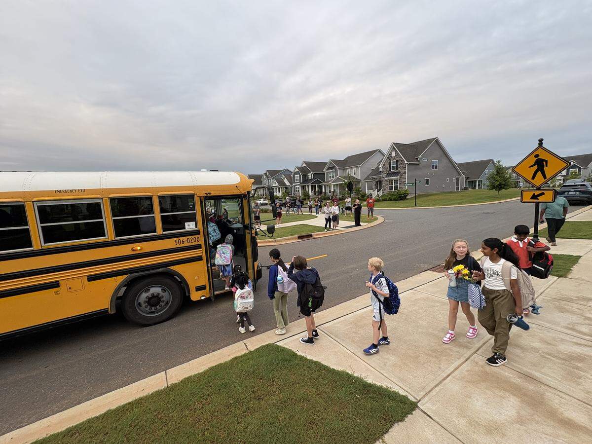 Students get on the bus Monday morning for the first day of school. The Fort Mill School District asked parents to consider using the bus after the district learned traffic guards wouldn’t be available this school year.