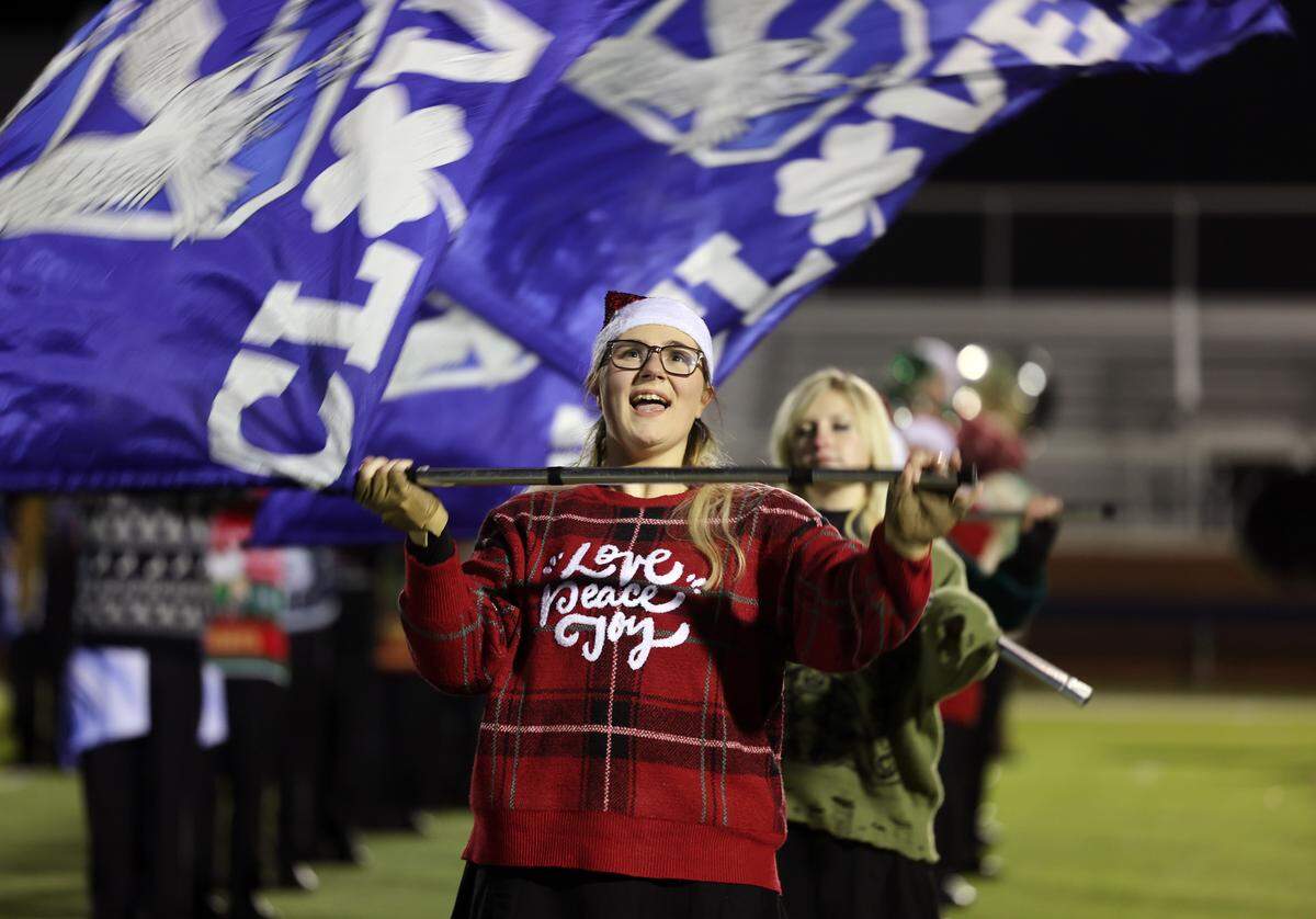 The Pride of Clover Marching Band performs music at Clover Memorial Stadium that they’ll plan in the Rose Parade in Pasadena, California, on New Year's Day.
