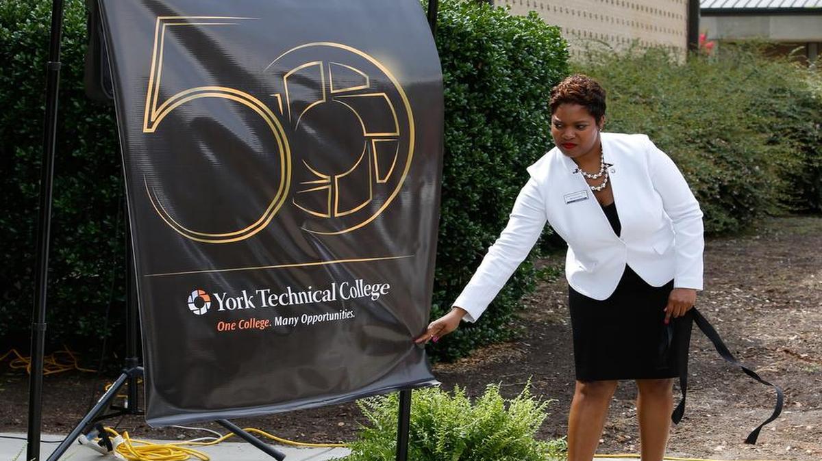 
Melanie Jones, vice president for college advancement, unveiled the logo for York Tech's 50th anniversary last June. .
