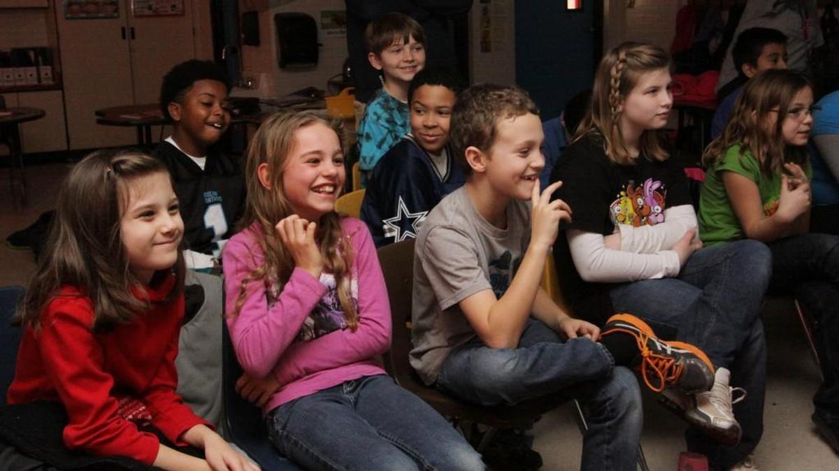 Students in a French language immersion program at Rosewood Elementary School in Rock Hill listen to a Canadian astronaut speak in French during a worldwide video broadcast Friday.