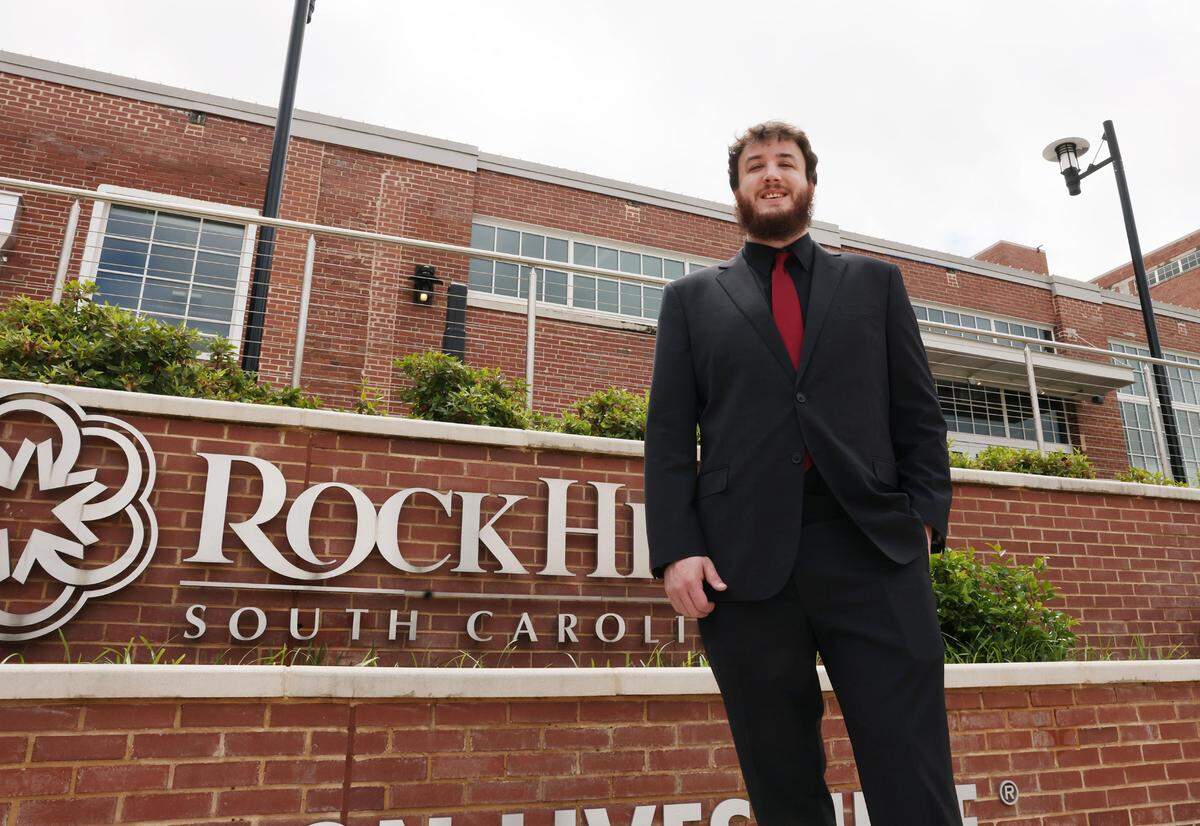 Winthrop University esports Director Josh Sides stands in front of the Lowenstein Building near downtown Rock Hill where the team’s headquarters will be located.