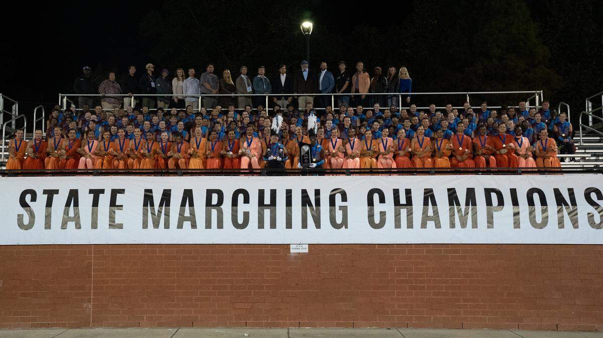 The Nation Ford High School marching band celebrates winning the 5A state championship on Saturday, just ahead of Fort Mill High School in second place.