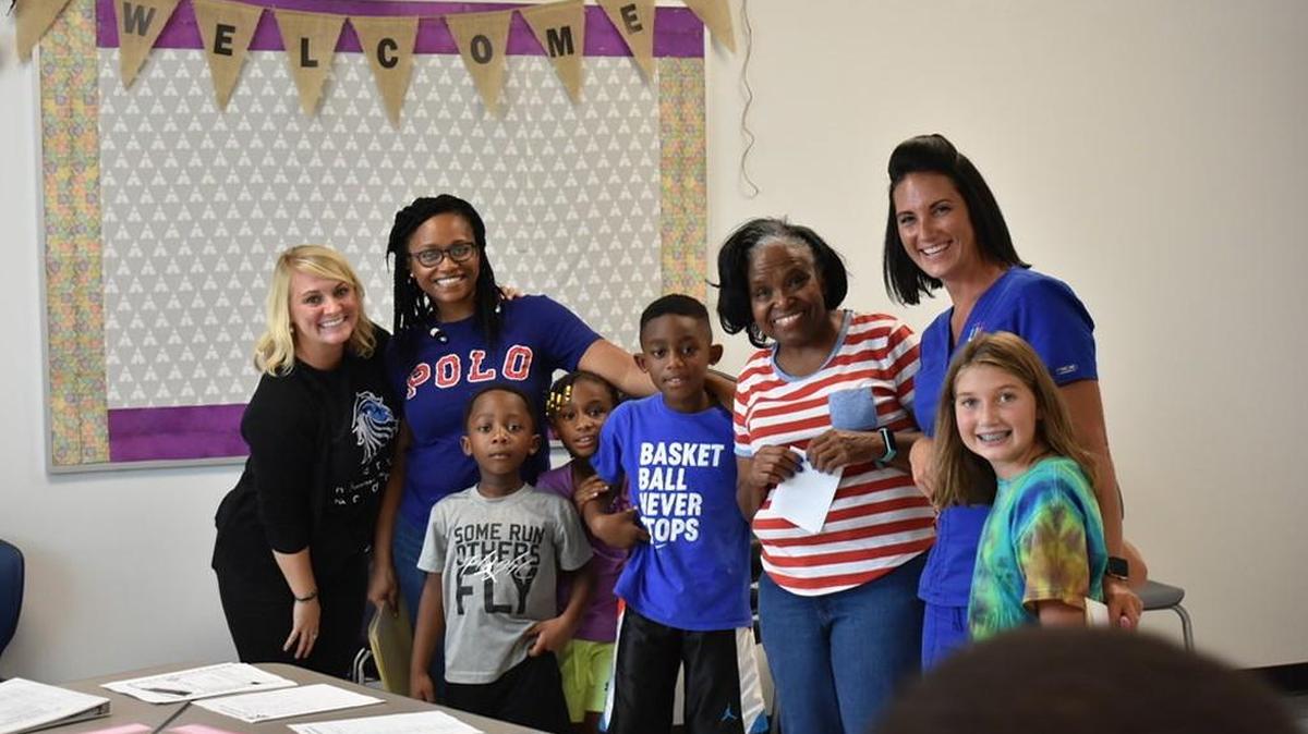 Riverwalk Academy’s staff and families mingle during this year’s meet and greet.
