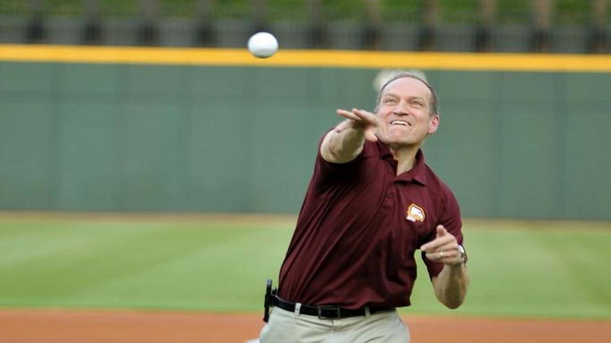 
Dan Mahony, president of Winthrop University, throws the ceremonial first pitch before a Charlotte Knights baseball game Wednesday as part of Winthrop Alumni Night at BB&T Ballpark in Charlotte. 
