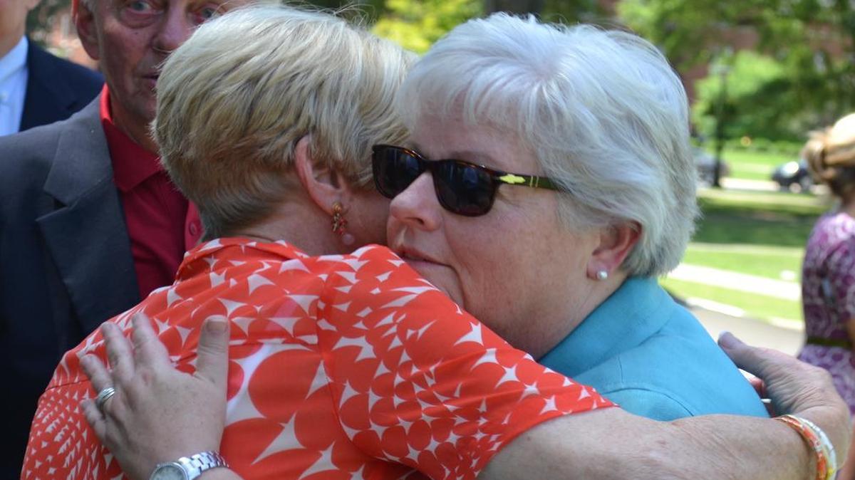 Winthrop University Acting President Debra Boyd, left, hugs Norma Thompson, wife of former Winthrop board chair Bob Thompson, Monday after community leaders honored Boyd for guiding the university during the last year. She will resume her provost duties.