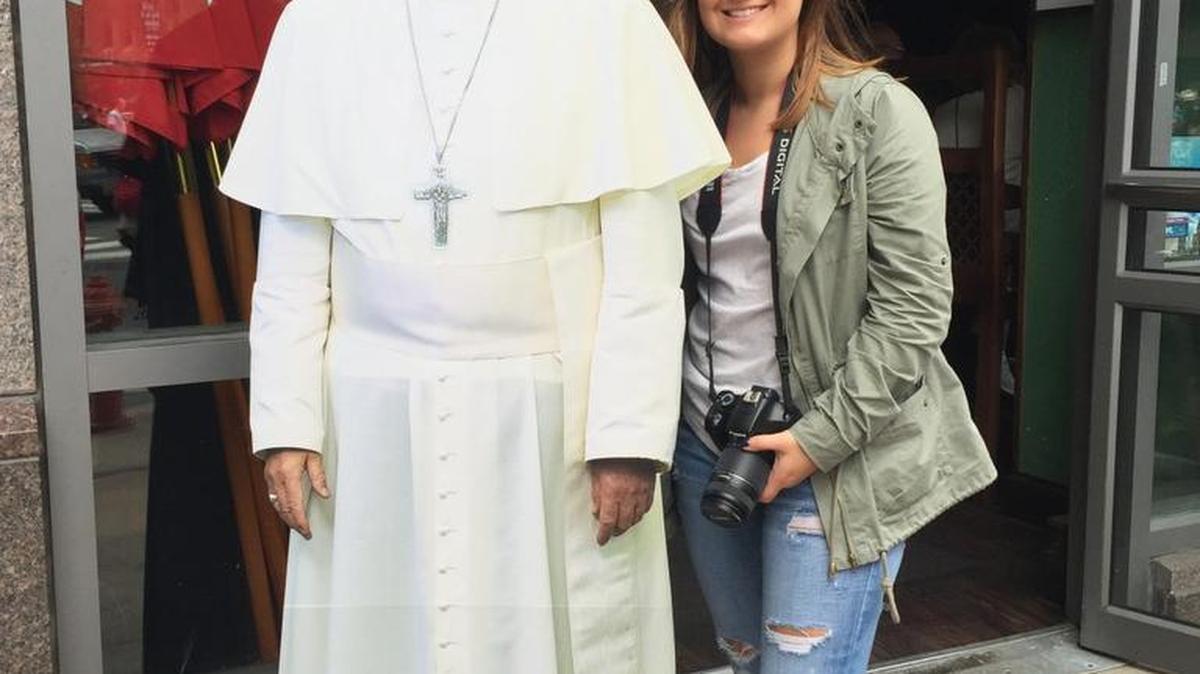 
Carolyn Rennix, Winthrop student, with a cardboard cutout Pope Francis 
