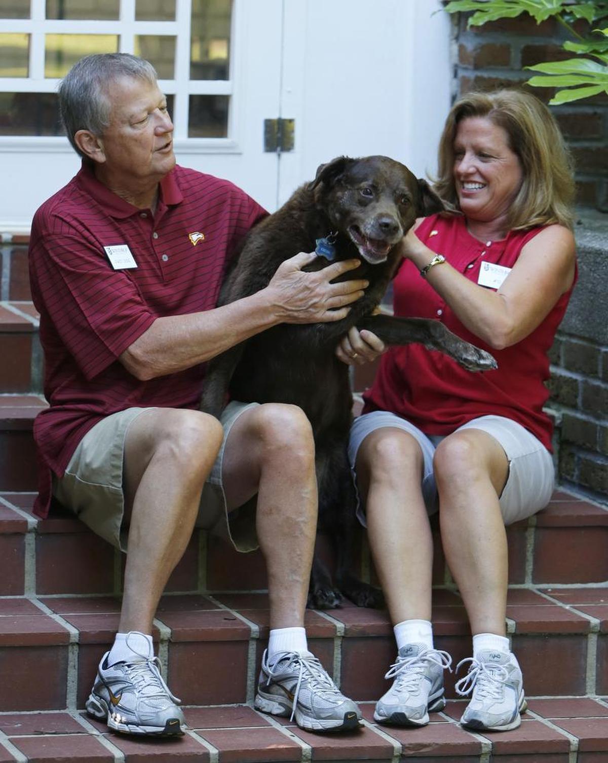 Jamie and Larry Williamson, with their dog Cocoa, in June 2013 after moving into the President’s House at Winthrop. 