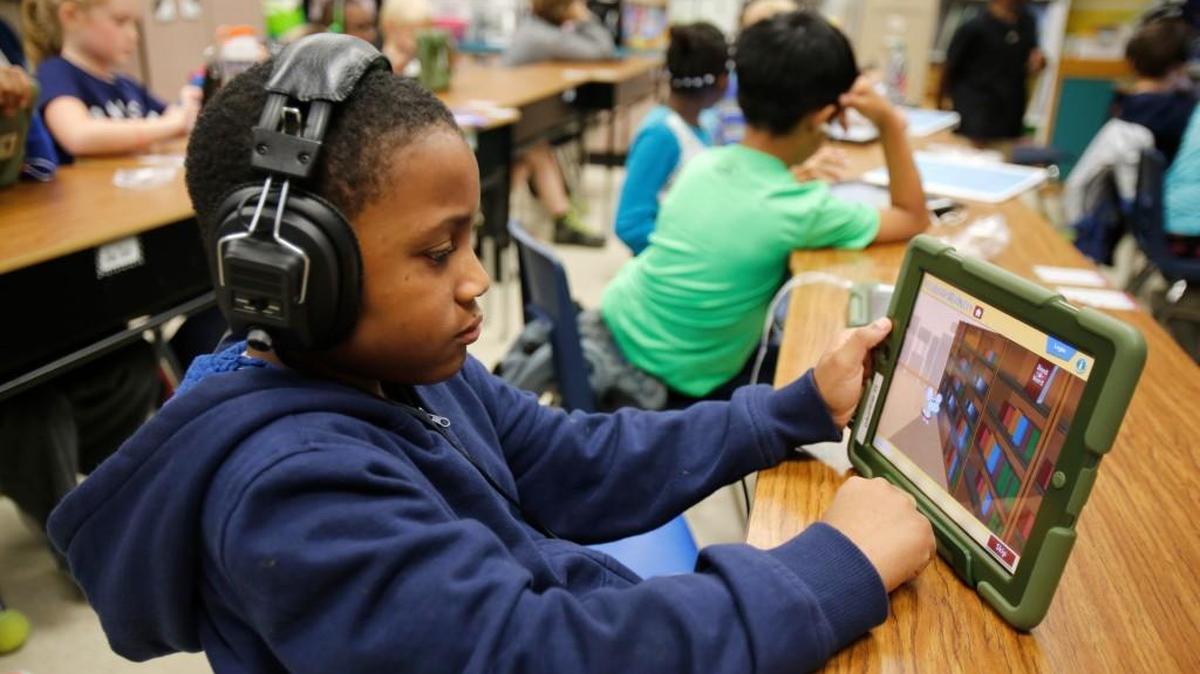 D’Auntrae Woods works in Rose Cox’s third-grade class Tuesday at Ebenezer Avenue Elementary School in Rock Hill.