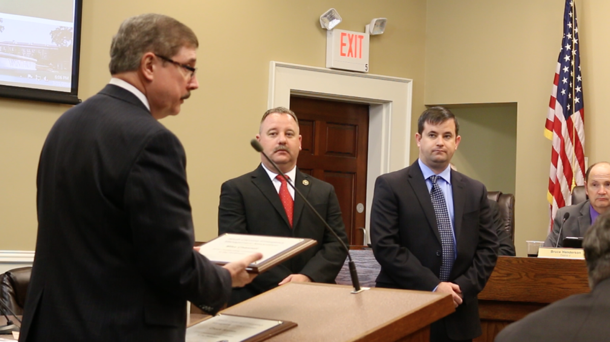 York County Council Chairman Britt Blackwell, left, recognizes Deputy Emergency Director Mike Channell and Director Chuck Haynes for being credited with an “Outstanding Contribution to the Profession” by SC emergency managers for their work during October’s flooding.