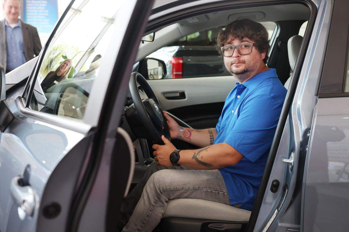 Former U.S. Marine Sergeant Jesse Bosnak sits in the front seat of his new Toyota Wednesday in Rock Hill. The Military Warriors Support Foundation in collaboration with Wells Fargo and Toyota of Rock Hill presented Bosnack withe car.