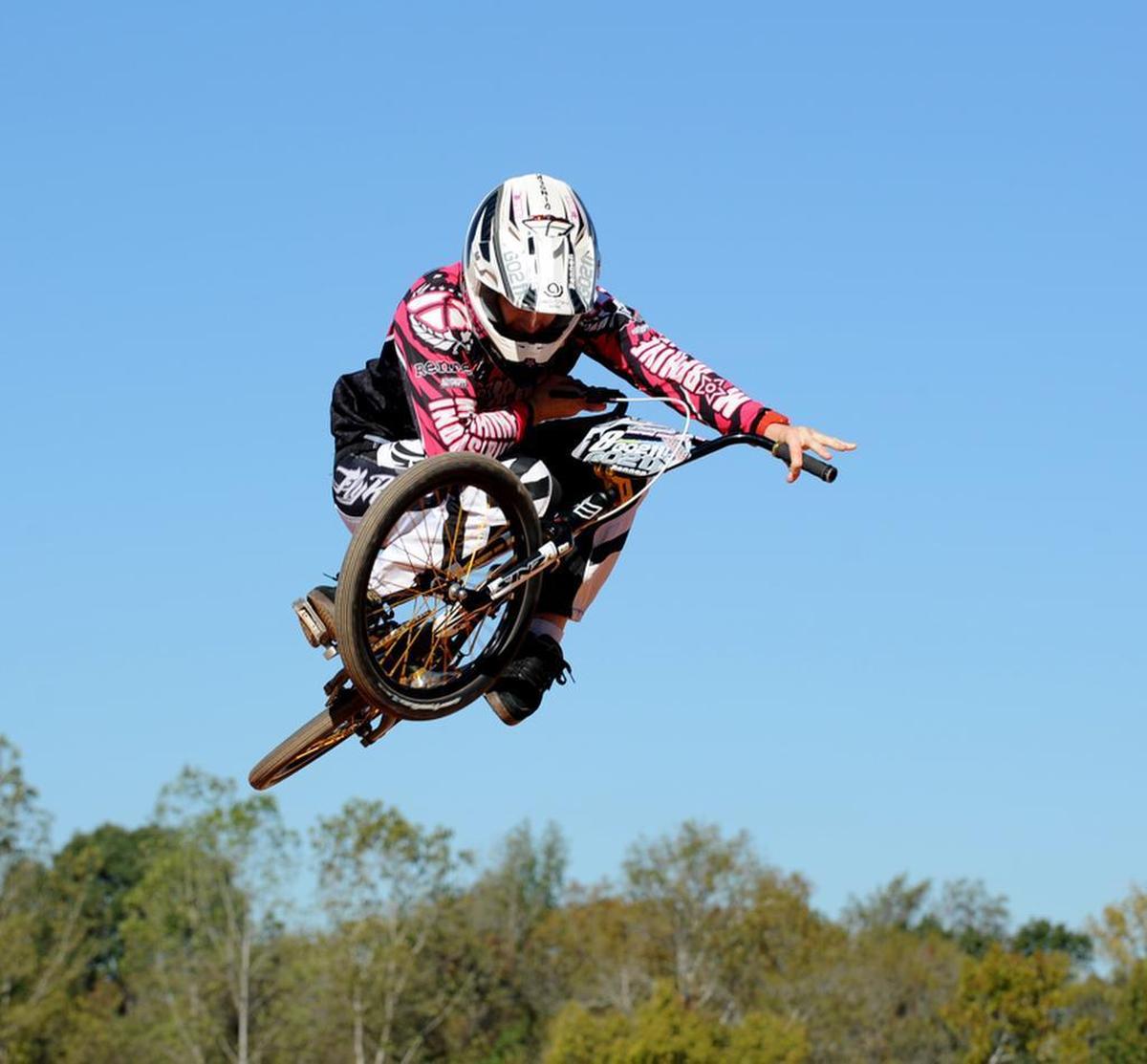 Veteran BMX Pro rider Tim Dinger, 34, shows off some of his riding skills during a past event at the Novant Health BMX Supercross track. 