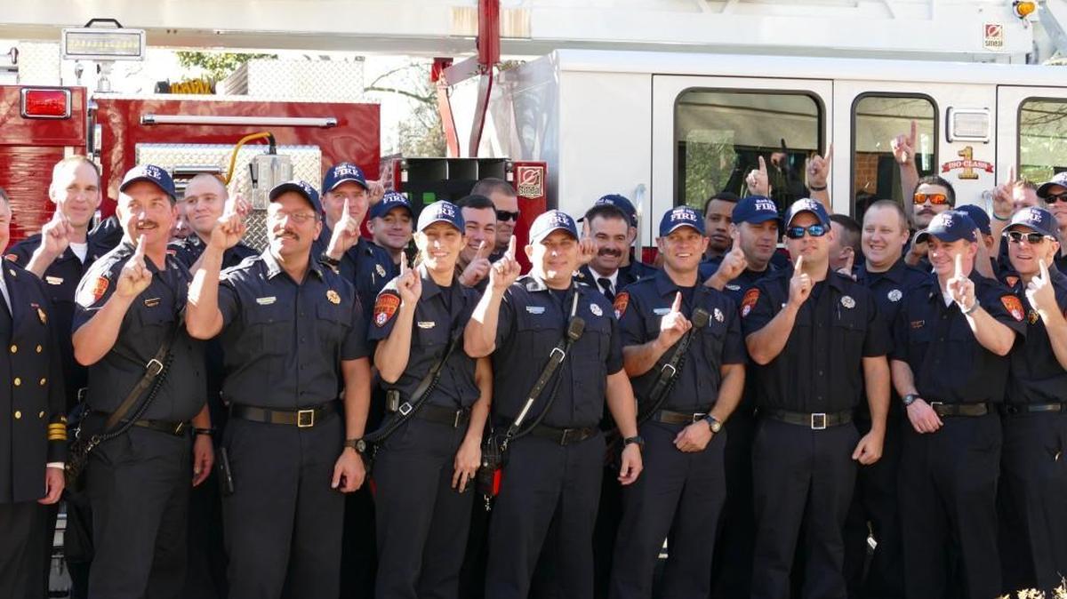 Rock Hill firefighters pose beside a fire engine after it was announced the city’s fire department has achieved the highest possible rating from a national insurance office. The new rating means insurance holders in the city will get “the lowest premiums available.”