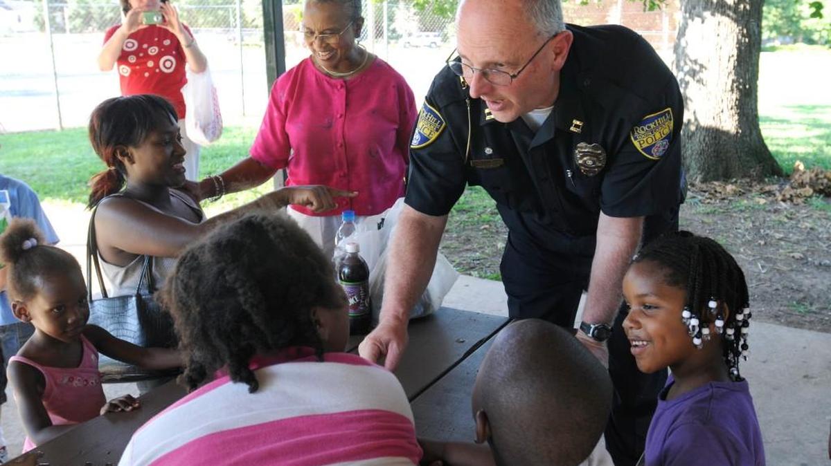 In 2011, Rock Hill Police Capt. Mark Bollinger talks with children at the Sunset Park neighborhood during a National Night Out event.