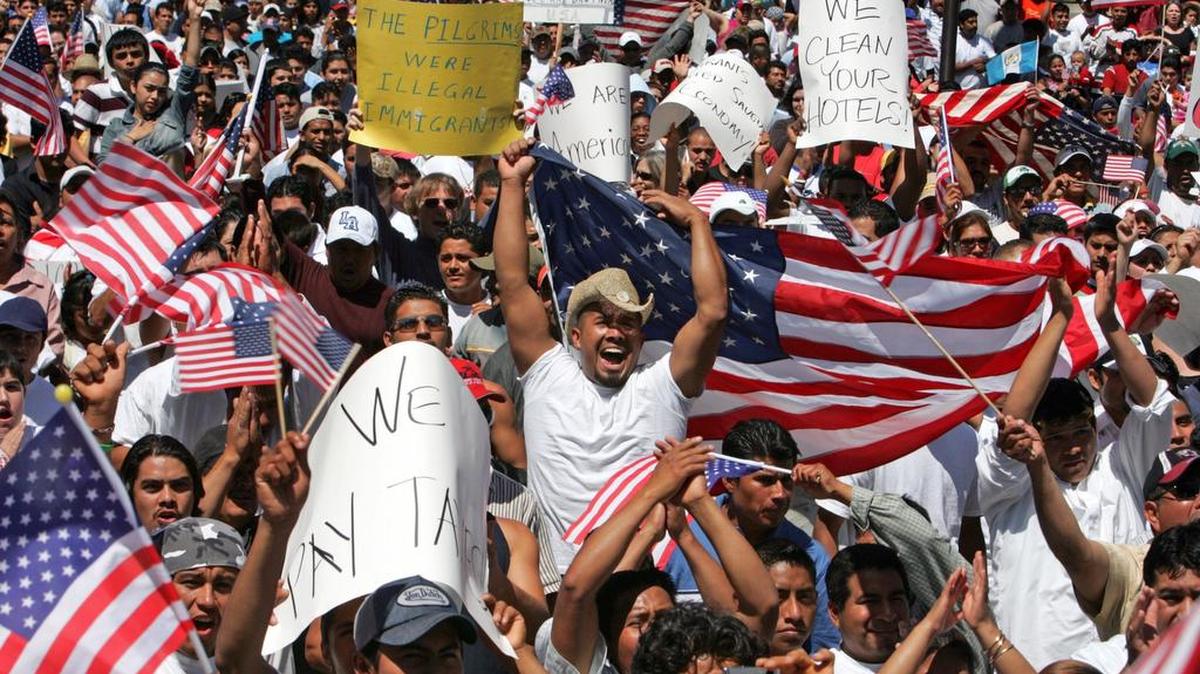
Jose R. Salazar, 28, center, joins about 4,000 people on South Carolina’s State House steps in April 2006 as part of a rally to protest a Congressional move to punish undocumented workers and those who assist them. 
