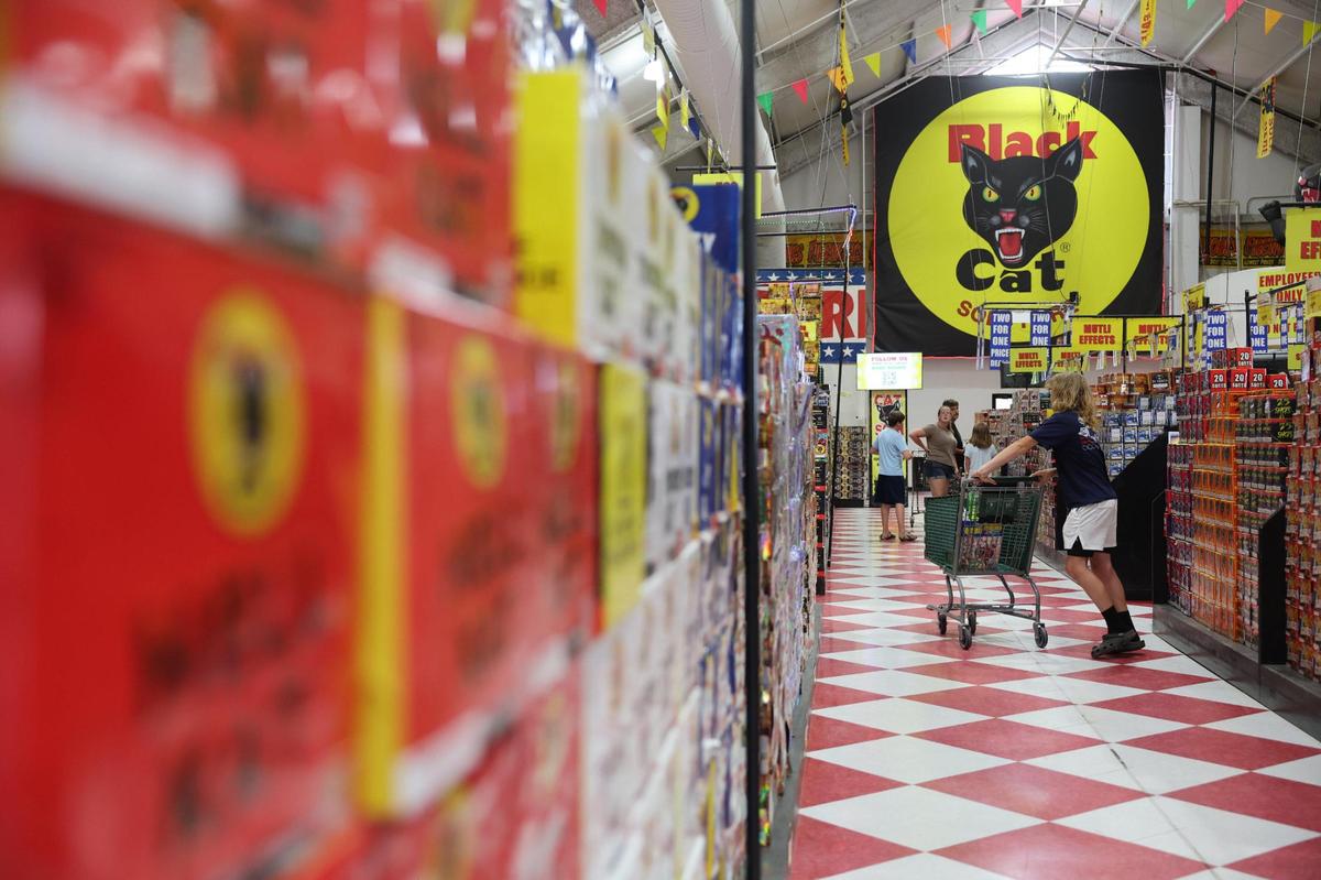Shoppers walk the aisles at Red Rocket Fireworks in Fort Mill.