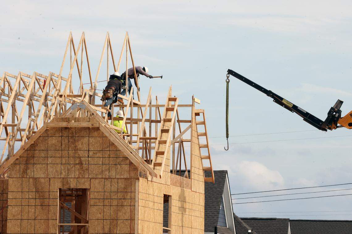 A construction crew builds a new house Monday in Fort Mill in the Elizabeth community. Home construction has been constant during the town’s growth surge that places it among the fastest growing cities and towns in the country.