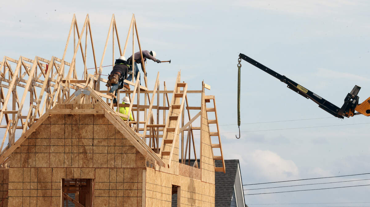 In this photo from last summer, a construction crew builds a new house in Fort Mill. Home construction has been constant during the town’s growth surge that places it among the fastest growing cities and towns in the country. York County is debating a school impact fee of nearly $30,000.