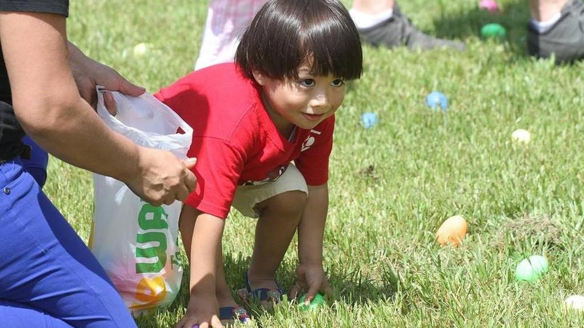 Anthony Contreras, 2, looks at other kids at the Great Easter Egg Classic at Cherry Park on Thursday.