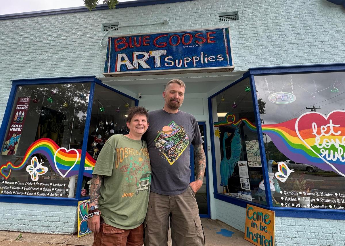 Mary Lazenby, left, and Andrew Lazenby stand in front of their art store Thursday at Blue Goose in Rock Hill.