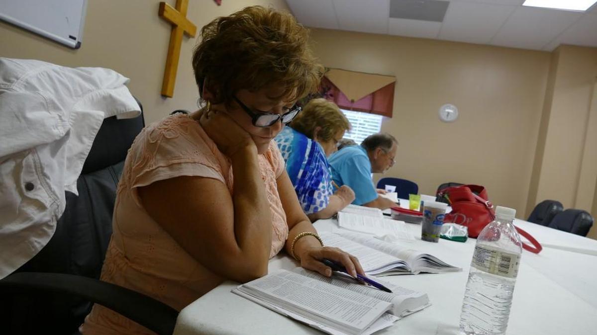 
Karen Cook reads during a Bible study at Park Ridge Baptist Church in Rock Hill. The church assembled a safety team two years ago to respond to different emergencies during church events. 
