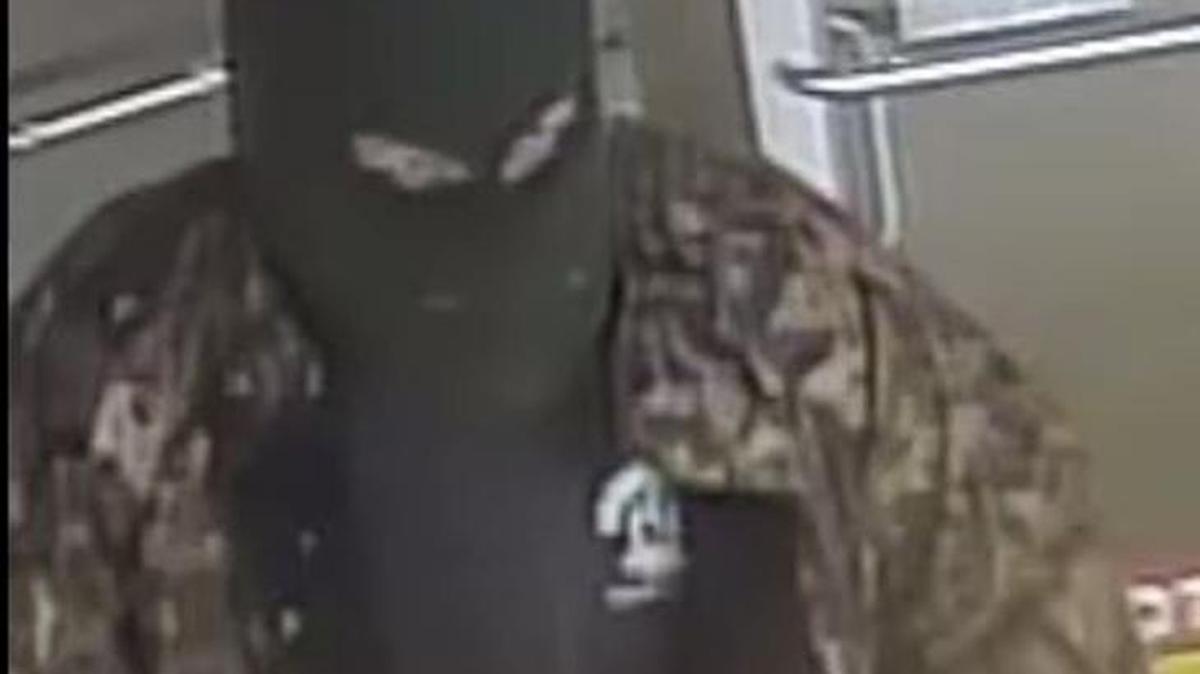 This is a photo from a video recording showing a masked gunman who robbed a Kershaw convenience store Tuesday night. Authorities are asking for the public’s help in finding the suspect.