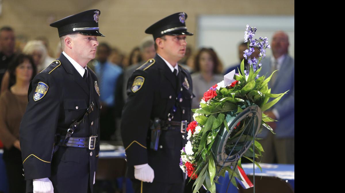 
The 20th Annual York County Police Honor and Memorial Service was held Wednesday at First Baptist Church in Rock Hill. Members of the Rock Hill Police Department Honor Guard Detective Brad Sims, left, and Investigator Danny Burkhart place a wreath in memory of slain officers during the service. 
