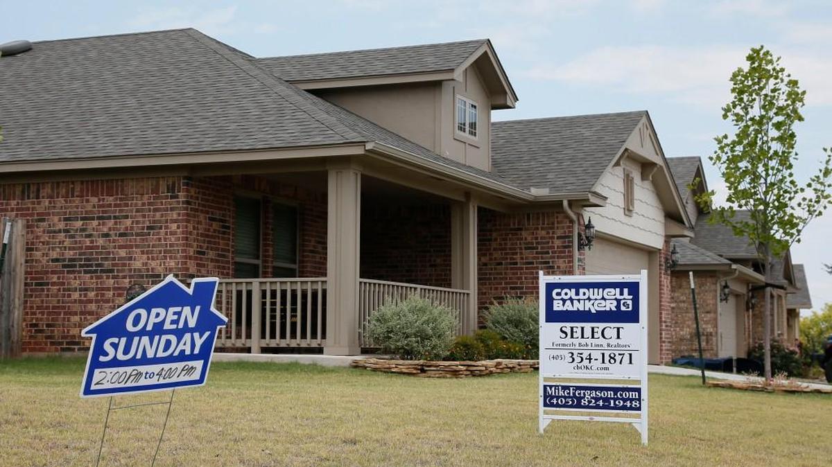 This photo shows real estate signs at a new home community in Oklahoma.