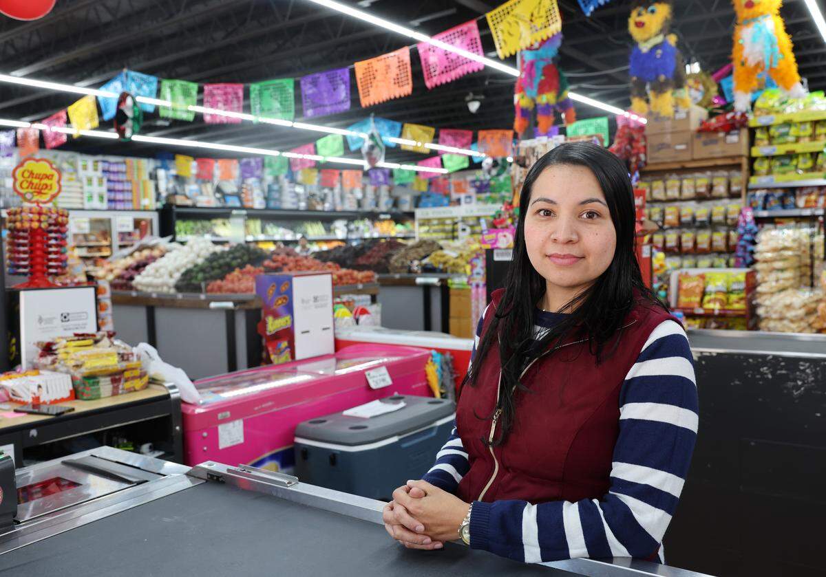 Rosa Belcran, manager of La Tapatia Supermercado in Rock Hill , S.C. stands in a nearly empty store Monday, Nov. 17, 2025. Shoppers have been largely absent over the weekend as immigration enforcement is happening in Charlotte.