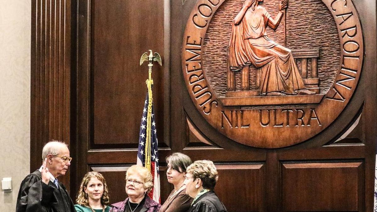 Costa M. Pleicones, left, is sworn in Thursday as chief justice of the South Carolina Supreme Court by departing Chief Justice Jean Toal.
