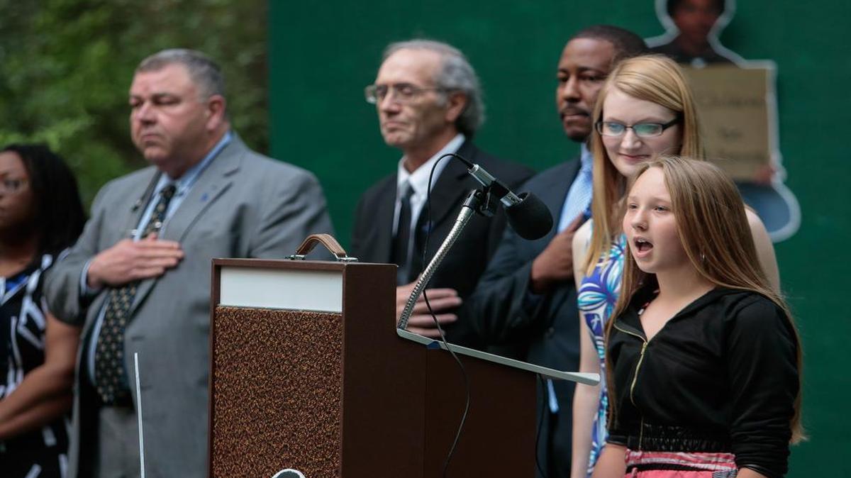 
Leianne Johnson and Grace Olivia perform the national anthem as the Museum of York County hosts this year’s Child Abuse Awareness Ceremony & Candlelight Vigil in recognition of National Child Abuse Prevention Month.
