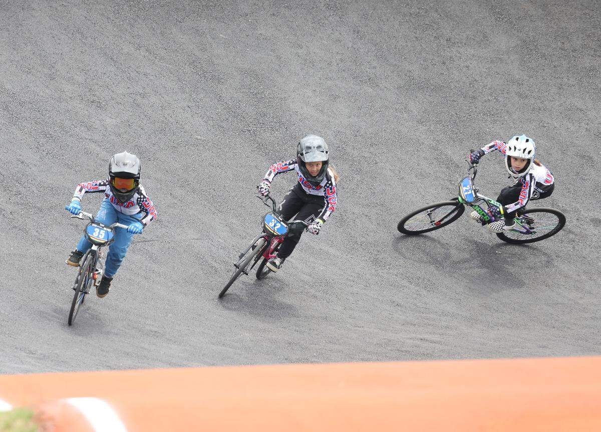 Irelyn McGinley, 8, and competitors from the United States, race around a turn Monday at the BMX World Championships in Rock Hill.